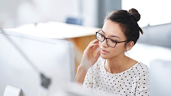 Woman at work thinking about changing jobs Woman at work thinking about changing jobs