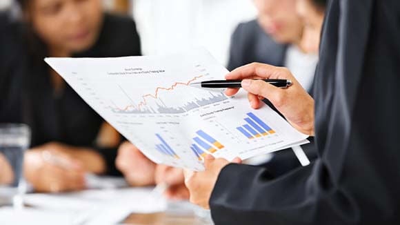 Financial controller looking at statistics Financial controller looking at statistics